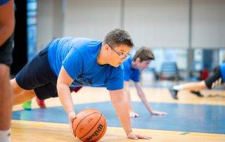 One bay playing basketball