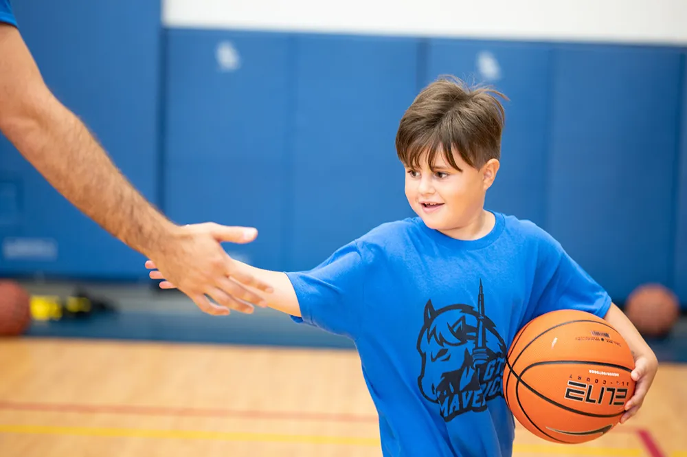 Little boy playing basketball